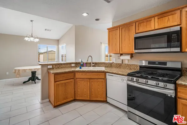 a white refrigerator freezer sitting in a kitchen