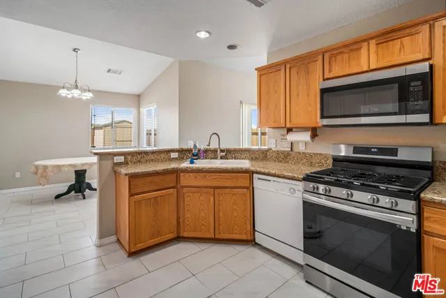 a white refrigerator freezer sitting in a kitchen