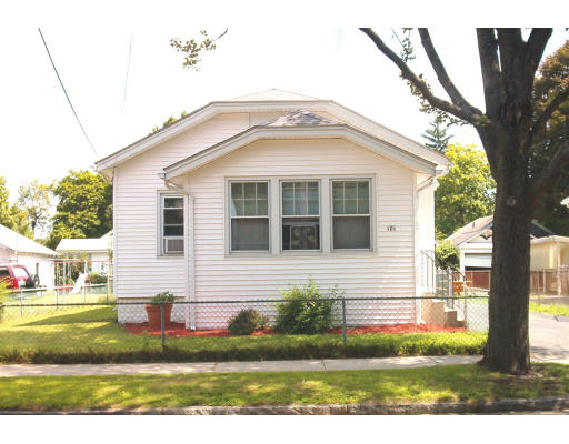181 Jasper Street Springfield, MA 01109 - Photo 1 of 1 a view of a white house next to a yard with big trees