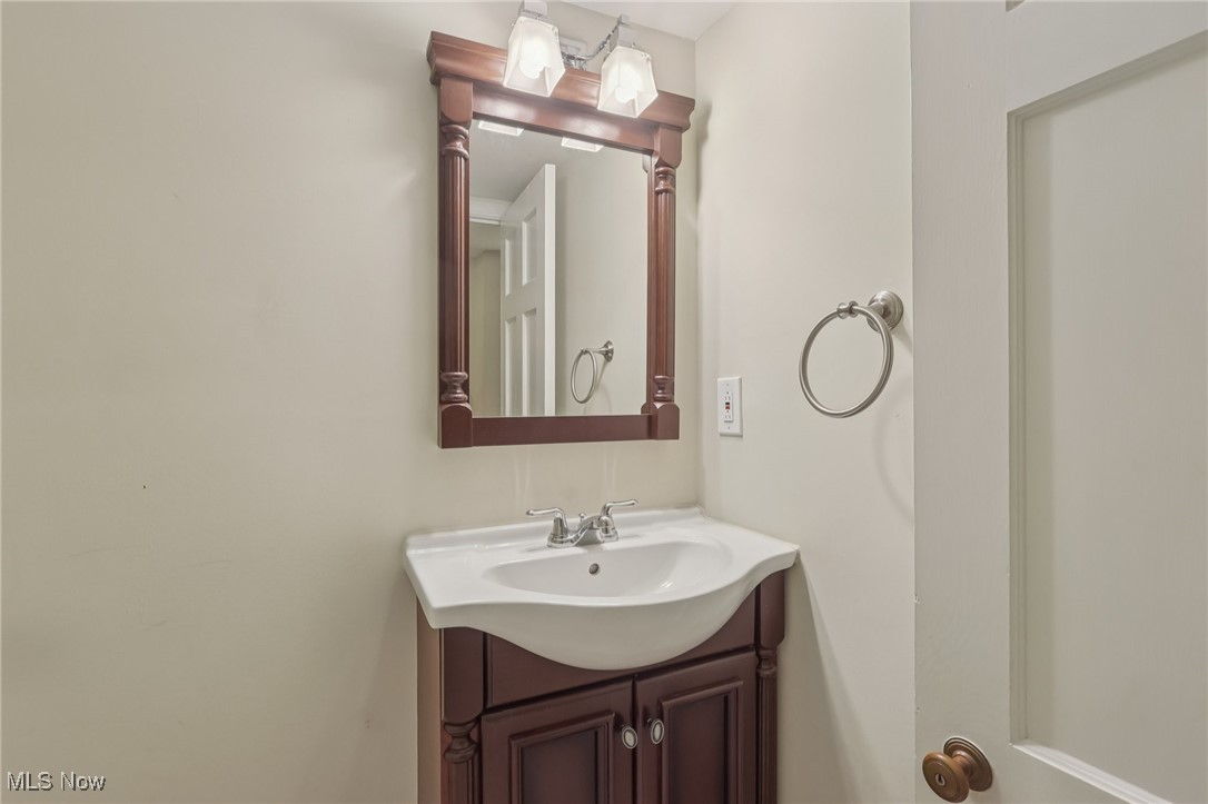 17024 Fernway Road Cleveland, OH 44120 - Photo 42 of 46 Half Bathroom with vanity on the lower level
