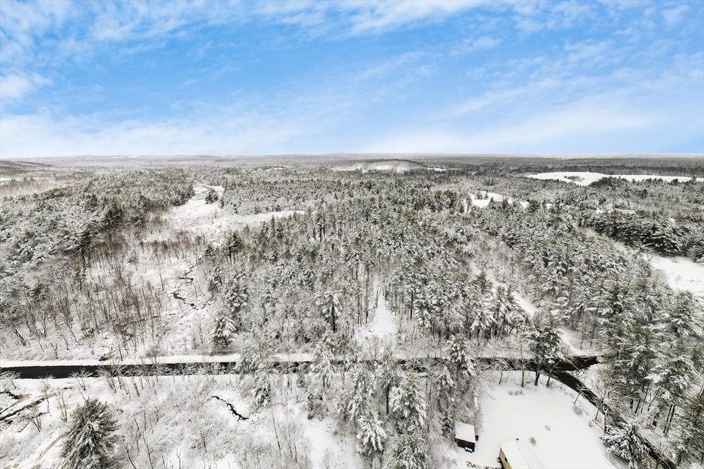 750 Teel Road Winchendon, MA 01475 - Photo 3 of 41 an aerial view of house with yard and mountain in the background