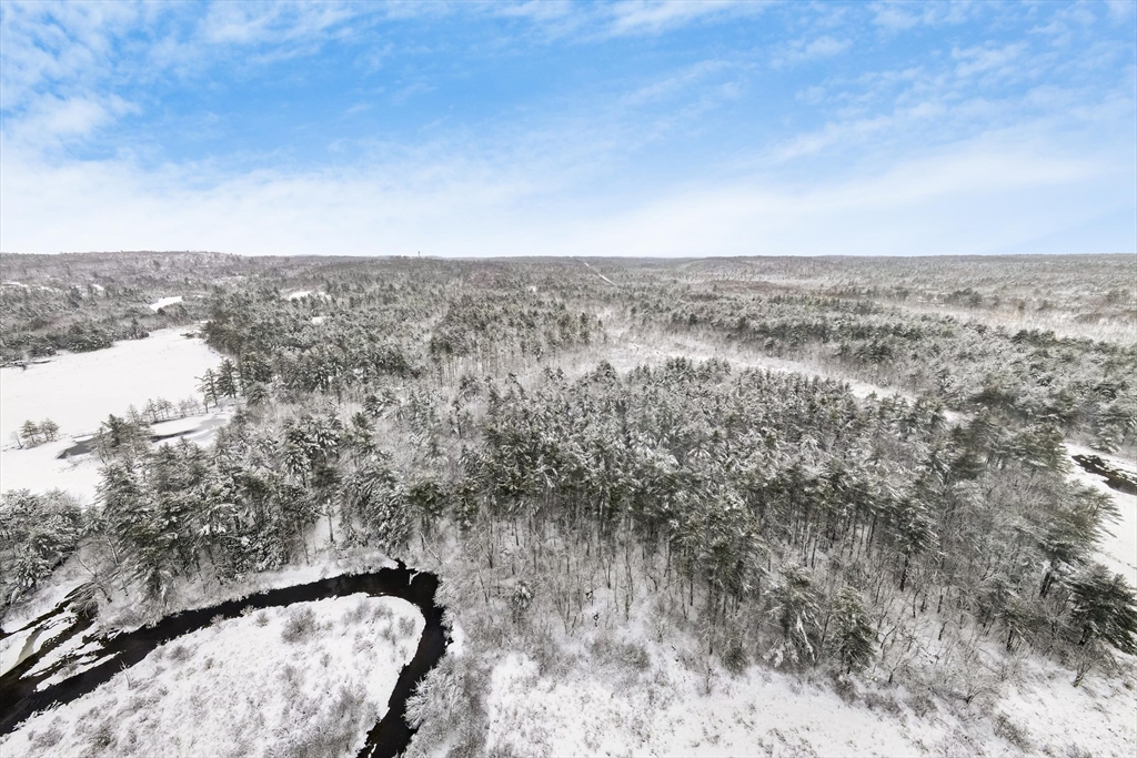750 Teel Road Winchendon, MA 01475 - Photo 5 of 41 a view of a dry yard with wooden fence