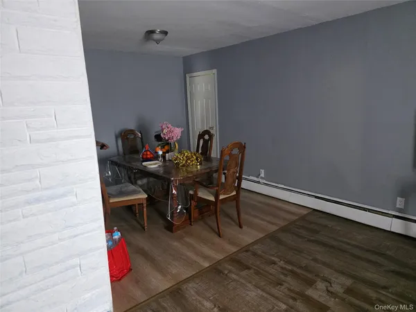 a dining room with furniture and wooden floor