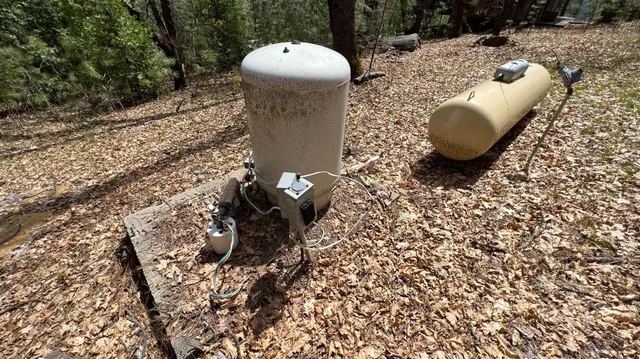 a view of a backyard with table and chairs
