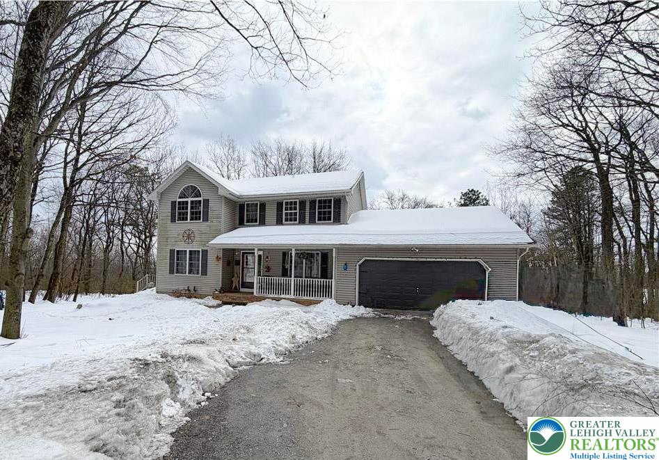 303 East Mountain Top Road Summit Hill, PA 18250 - Photo 1 of 31 a view of a white house with a yard covered in snow