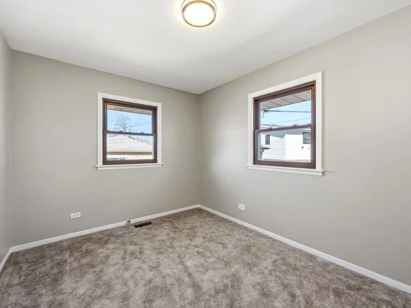 a view of room with window and ceiling fan