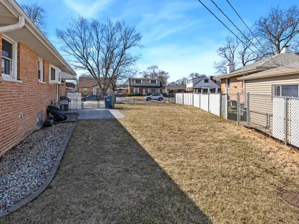 a view of a backyard with a large tree