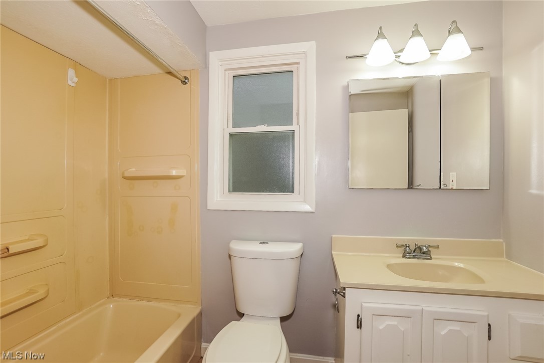1345 Ford Road Lyndhurst, OH 44124 - Photo 18 of 20 Full bathroom featuring vanity, bathing tub / shower combination, and toilet