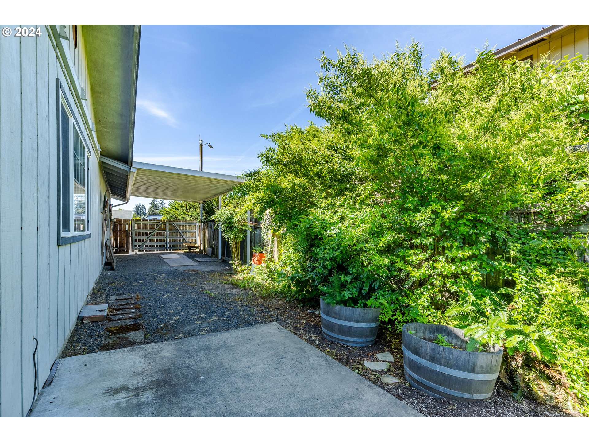 2350 8th Street Springfield, OR 97477 - Photo 34 of 34 a view of a backyard with plants and a patio