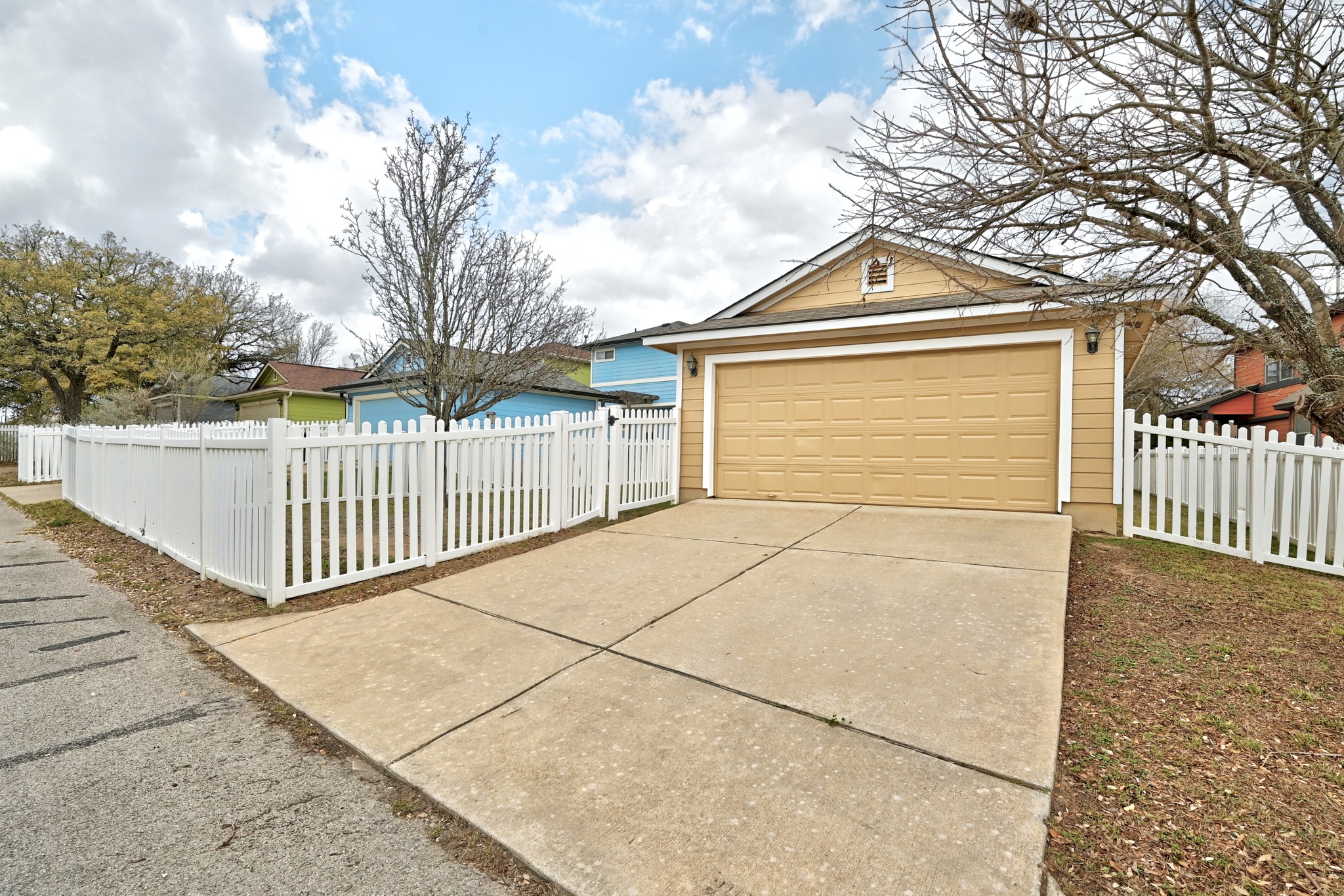 332 Wetzel Kyle, TX 78640 - Photo 22 of 31 a view of a house with a fence and a garage