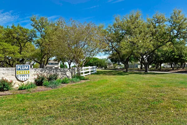 a view of a lake with table and chairs