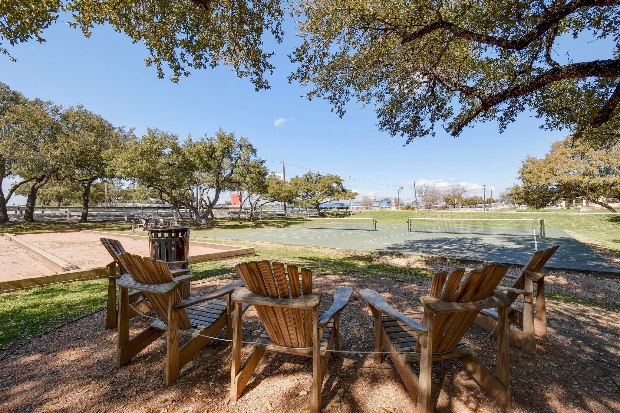 332 Wetzel Kyle, TX 78640 - Photo 27 of 31 a view of a lake with table and chairs