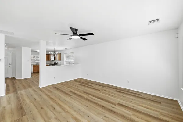 a view of a kitchen with a dishwasher and a refrigerator
