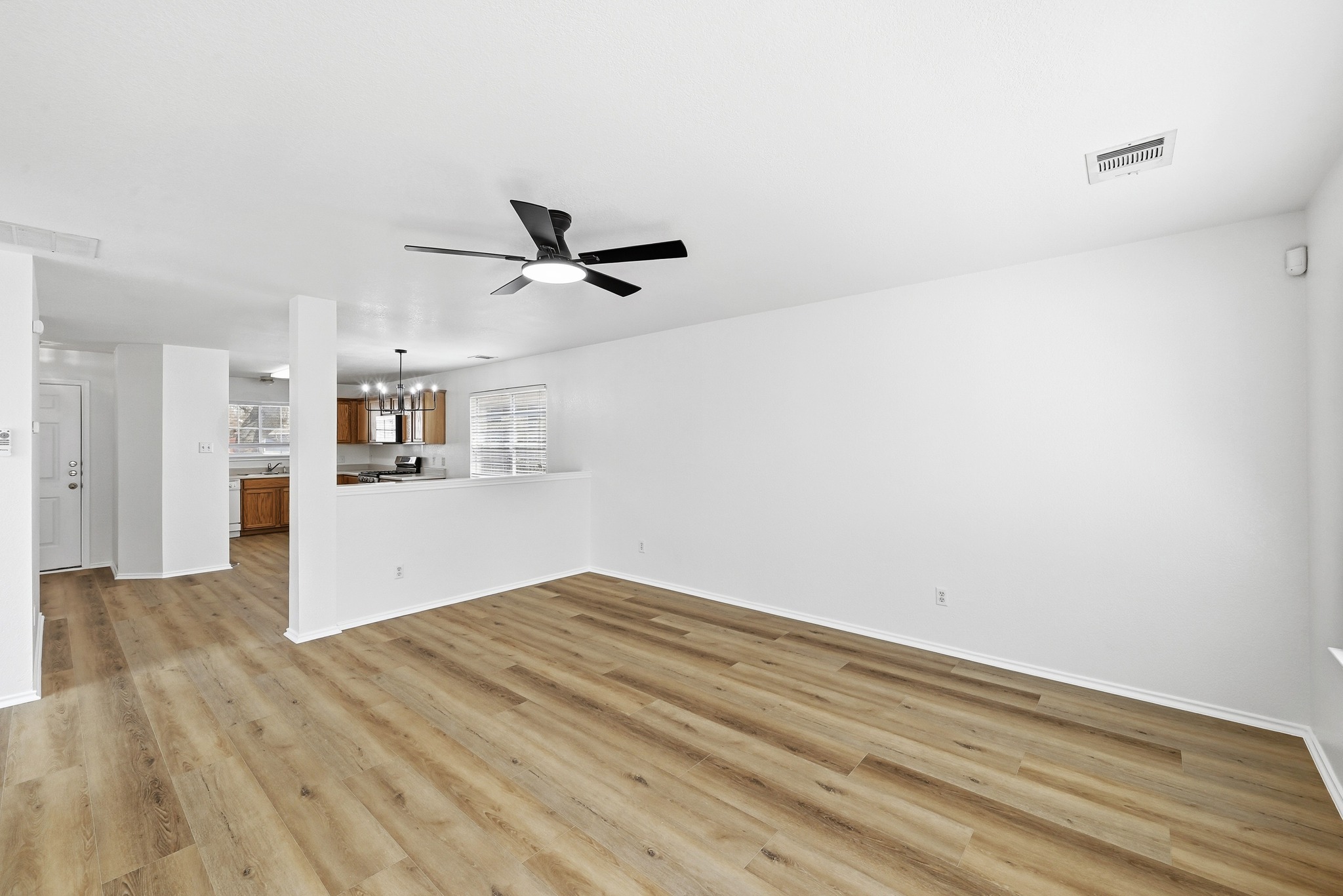 332 Wetzel Kyle, TX 78640 - Photo 5 of 31 a view of a kitchen with a dishwasher and a refrigerator