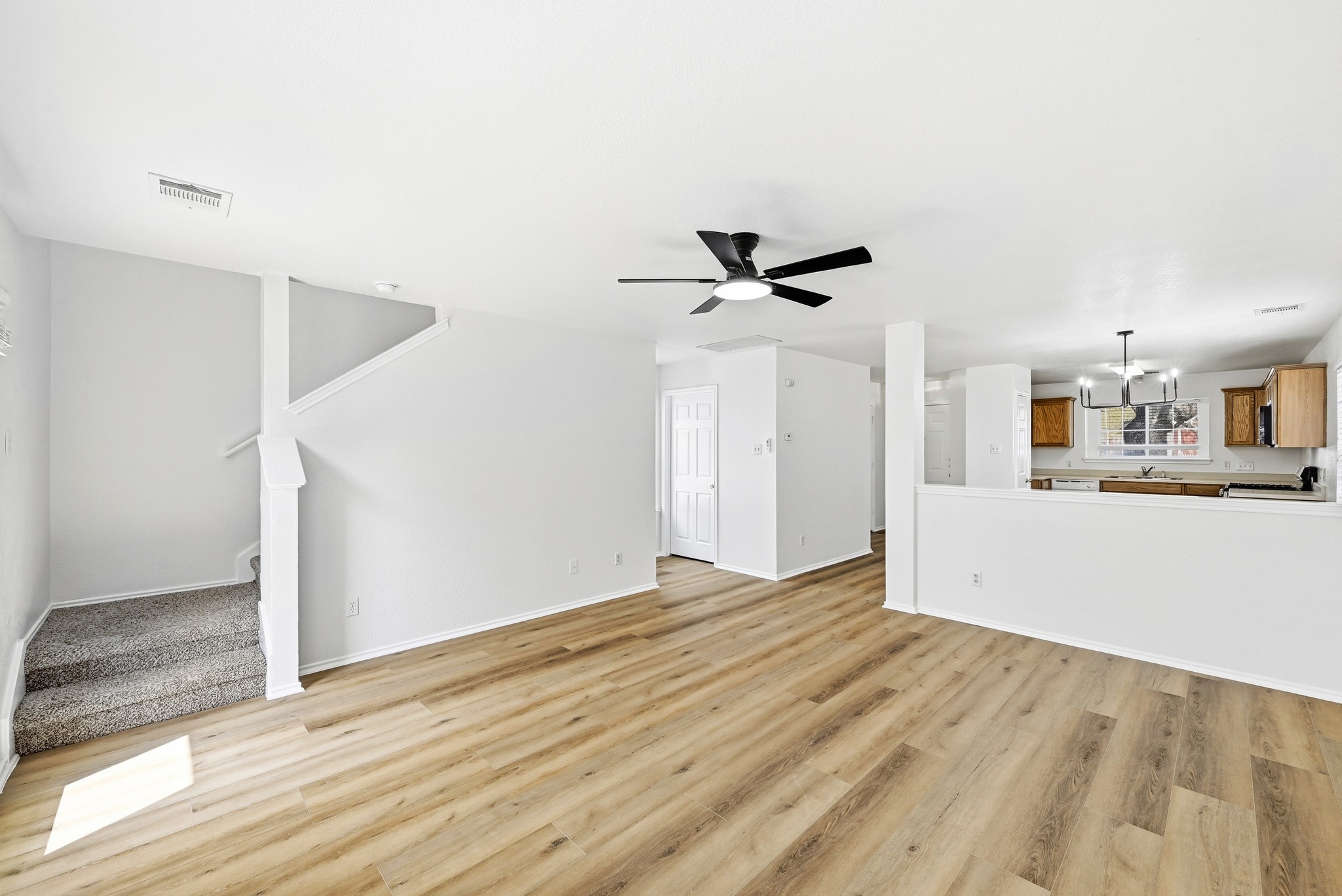 332 Wetzel Kyle, TX 78640 - Photo 8 of 31 a view of empty room with wooden floor and ceiling fan
