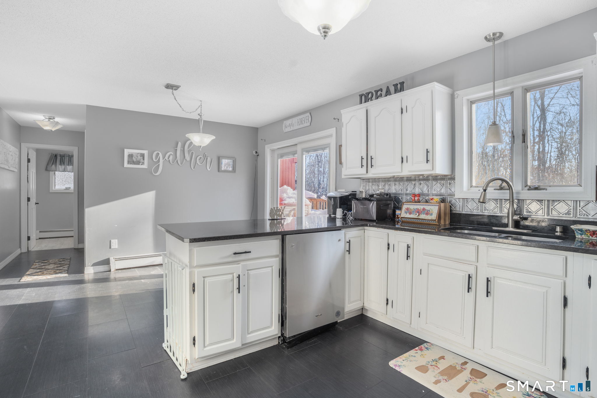 83 Kate Downing Road Plainfield, CT 06374 - Photo 12 of 40 a kitchen with granite countertop white cabinets white appliances and sink