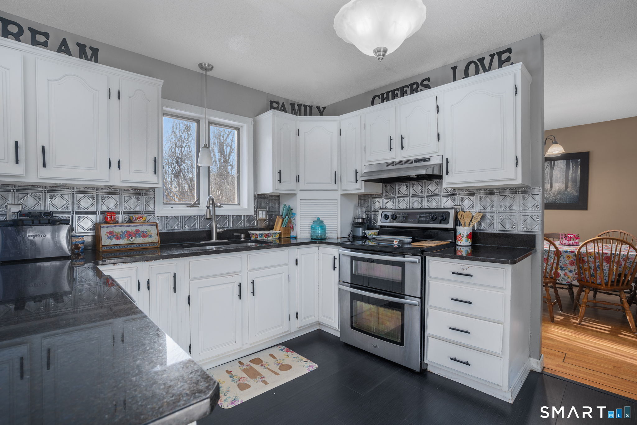 83 Kate Downing Road Plainfield, CT 06374 - Photo 14 of 40 a kitchen with granite countertop white cabinets and white appliances