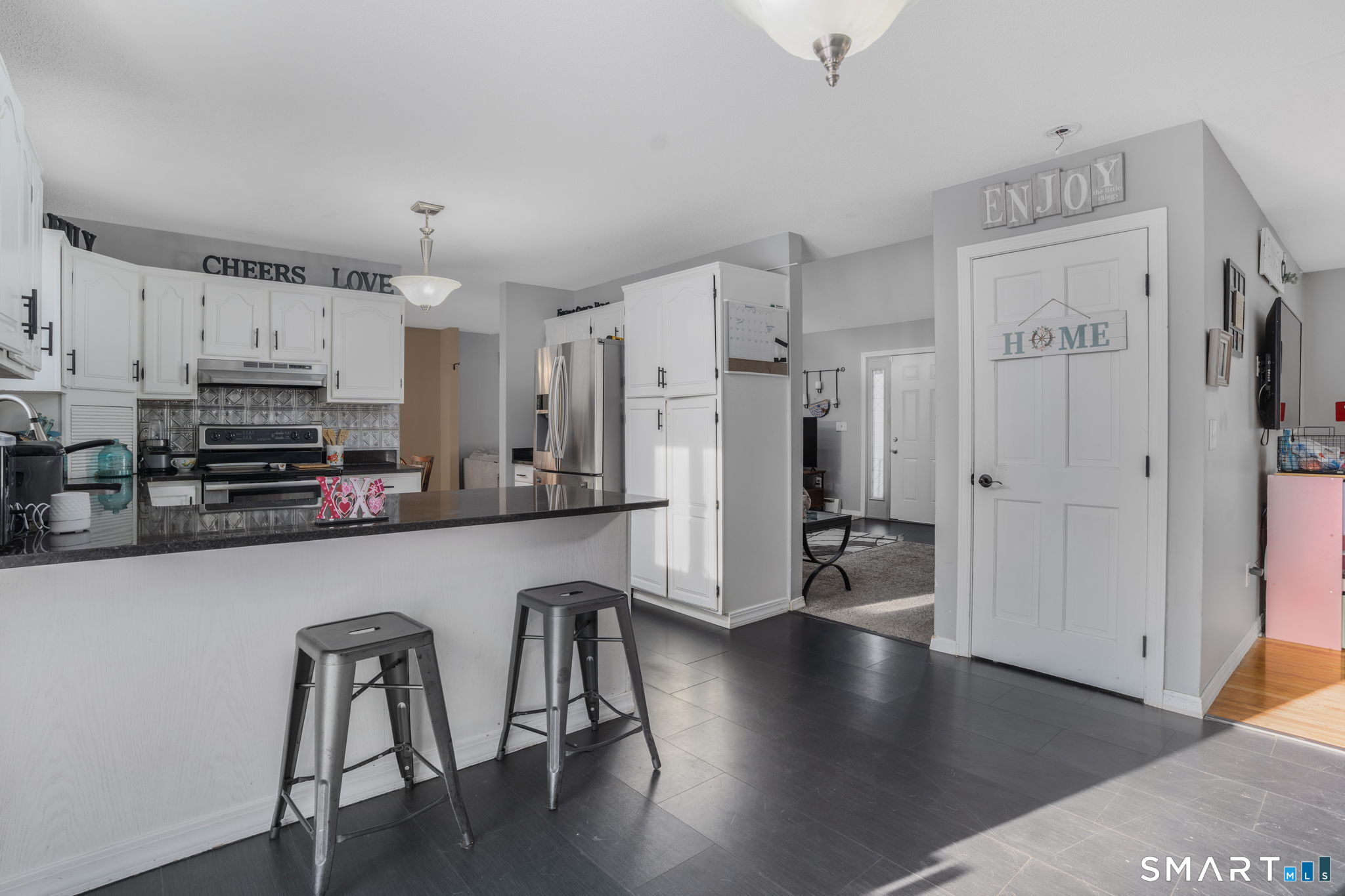 83 Kate Downing Road Plainfield, CT 06374 - Photo 15 of 40 a kitchen with stainless steel appliances a refrigerator and a stove top oven