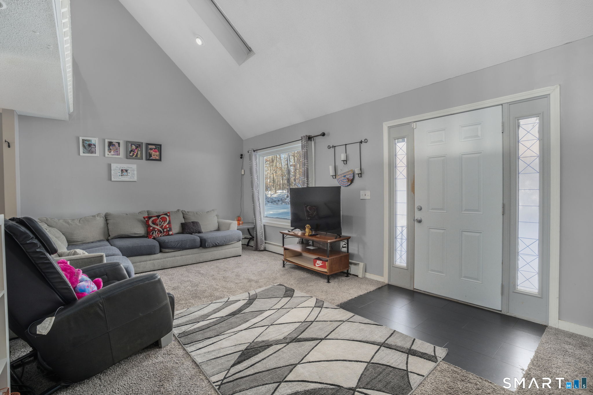 83 Kate Downing Road Plainfield, CT 06374 - Photo 27 of 40 a living room with furniture and a flat screen tv