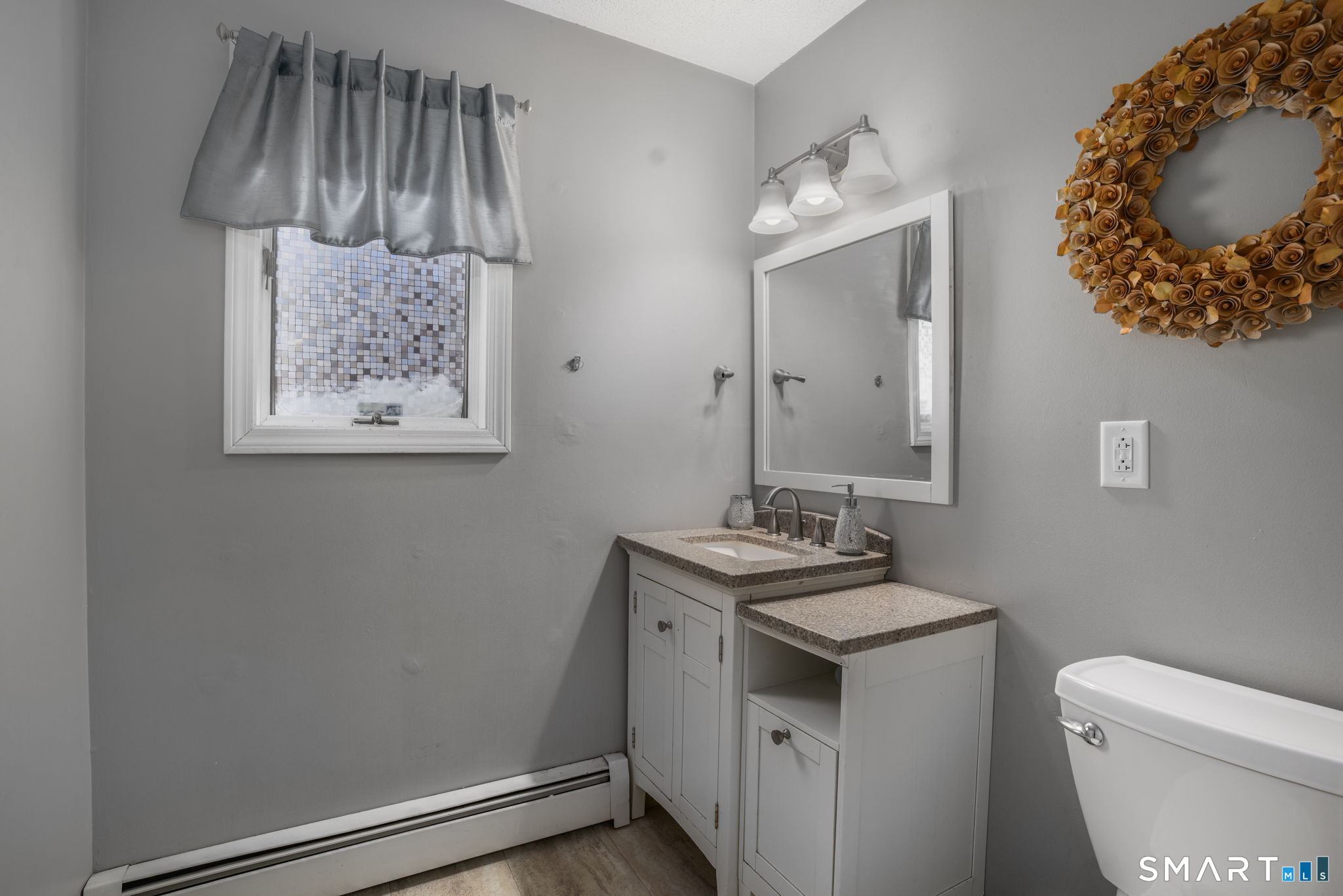 83 Kate Downing Road Plainfield, CT 06374 - Photo 29 of 40 a bathroom with a toilet sink and mirror