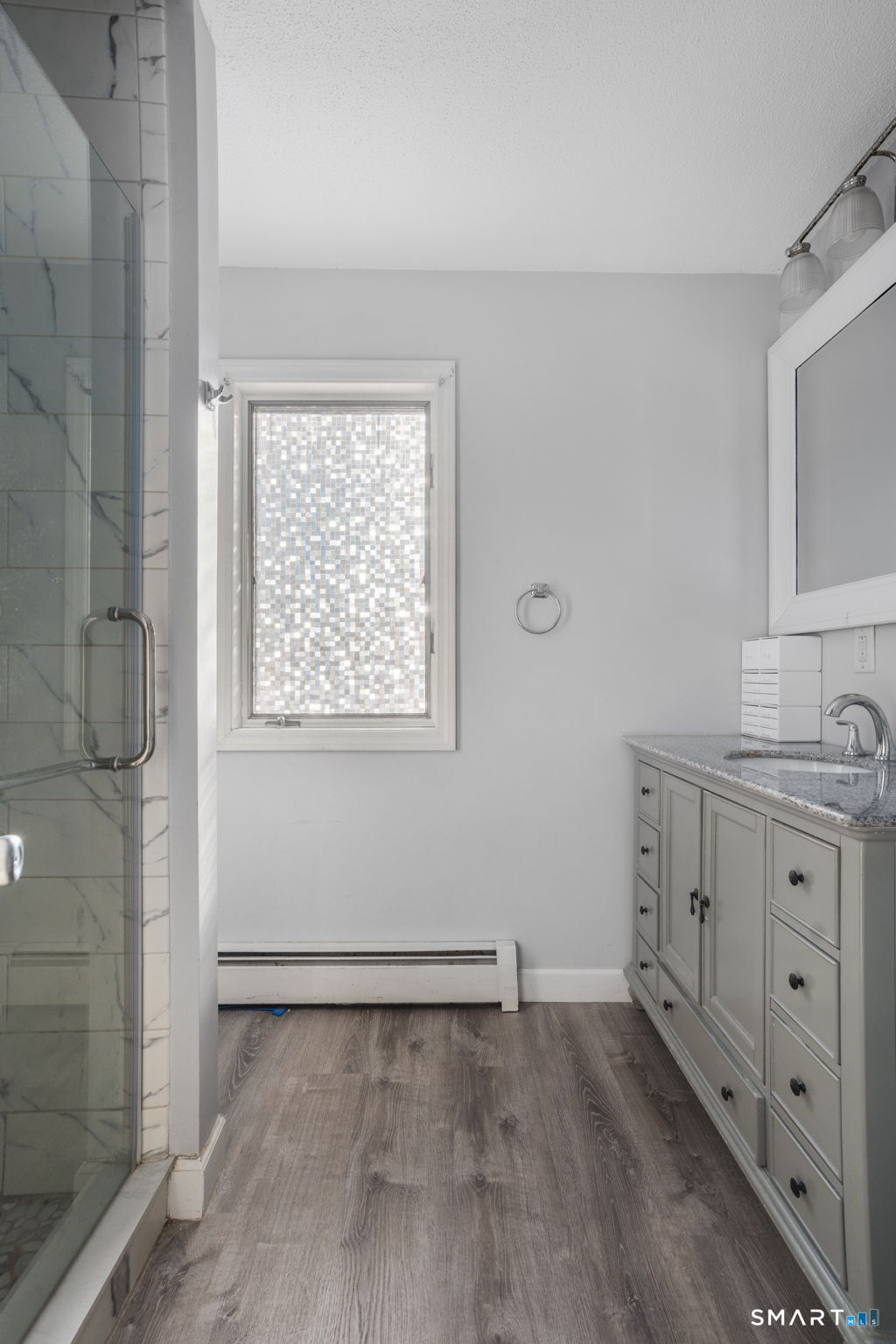 83 Kate Downing Road Plainfield, CT 06374 - Photo 30 of 40 a bathroom with a granite countertop sink toilet and shower