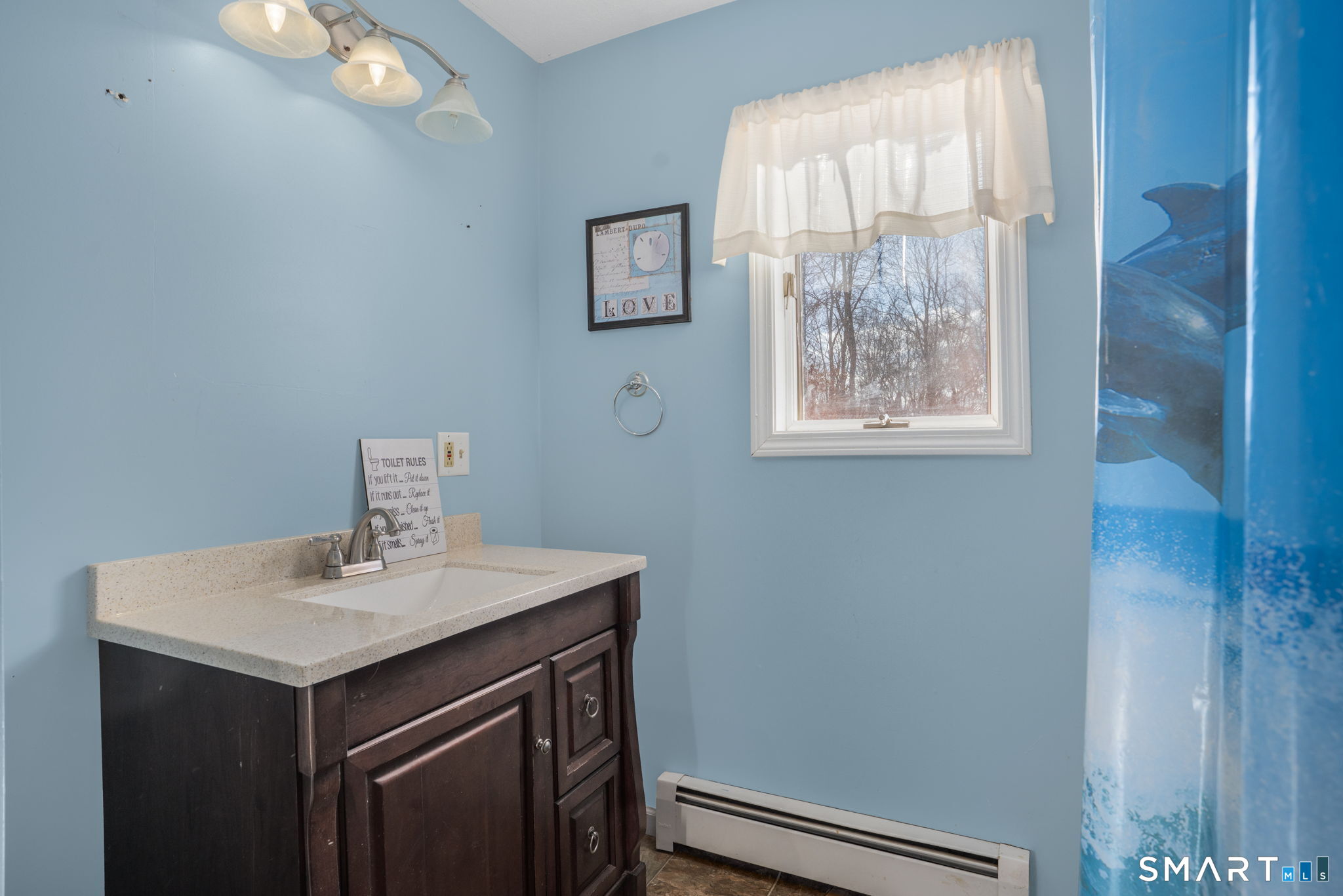 83 Kate Downing Road Plainfield, CT 06374 - Photo 34 of 40 a bathroom with a sink a vanity and a window