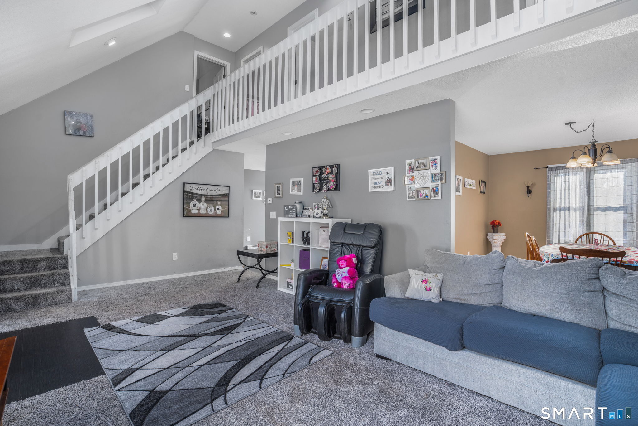 83 Kate Downing Road Plainfield, CT 06374 - Photo 6 of 40 a living room with furniture and stairs