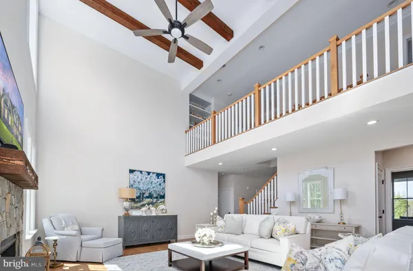 a spacious bedroom with a bed and a large window