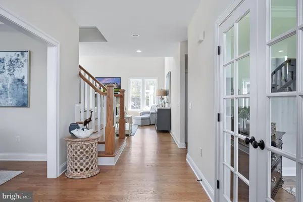 a dining room with furniture a rug and a window