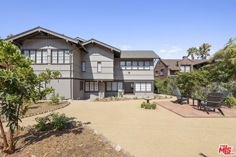 a view of a house with outdoor seating space