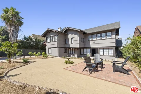 a view of a house with outdoor seating