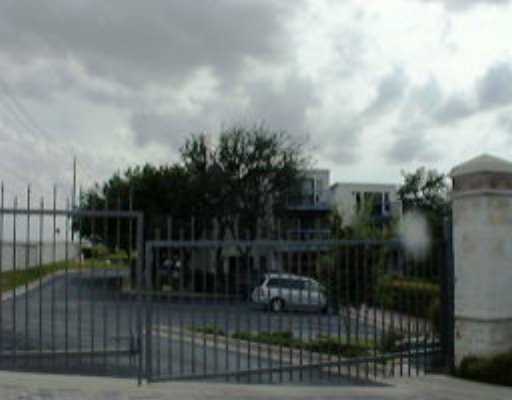 a terrace with barbeque oven and outdoor seating