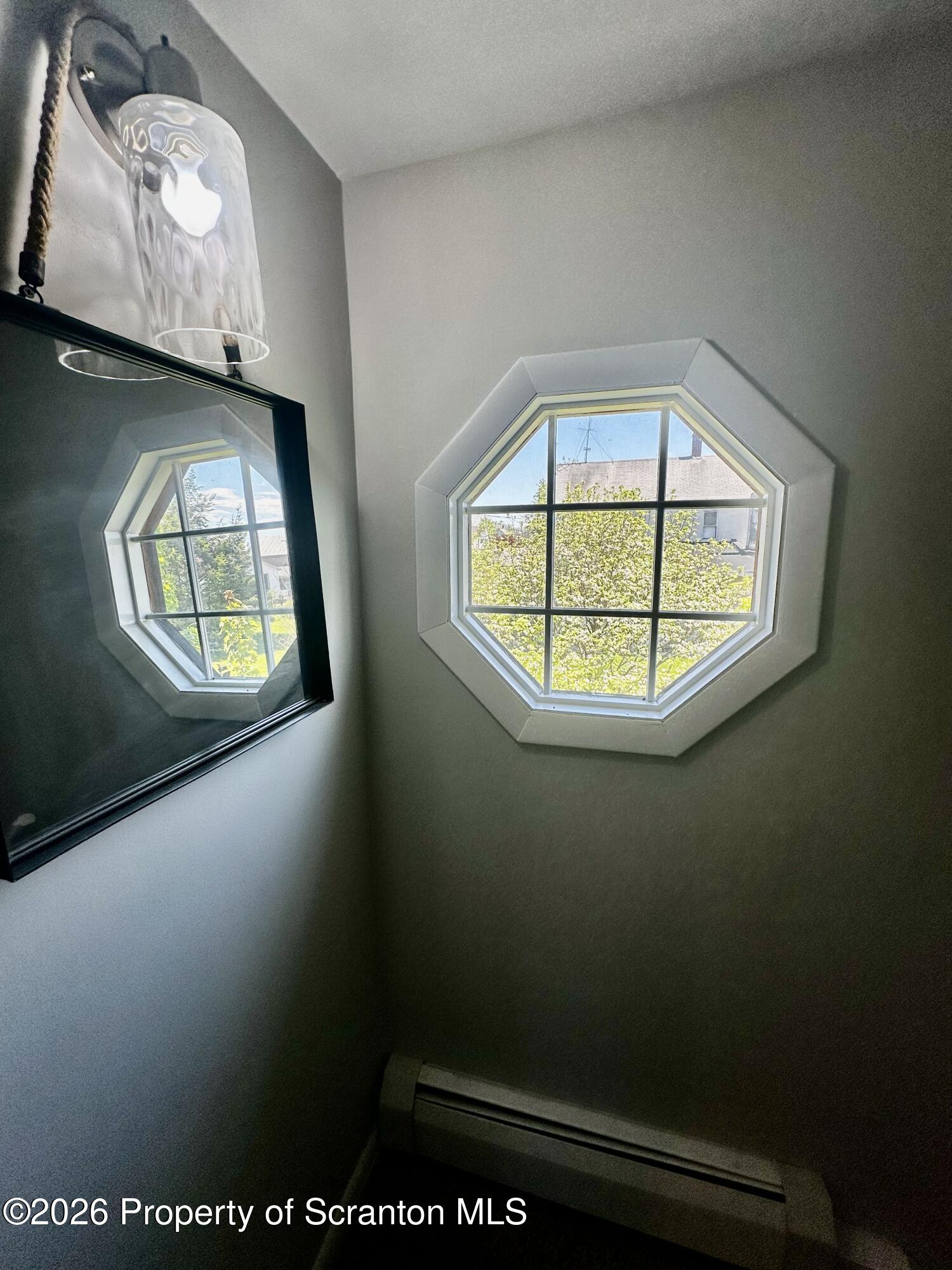 1727 Bulwer Street Scranton, PA 18504 - Photo 29 of 40 an view of a hallway with wooden floor and a window