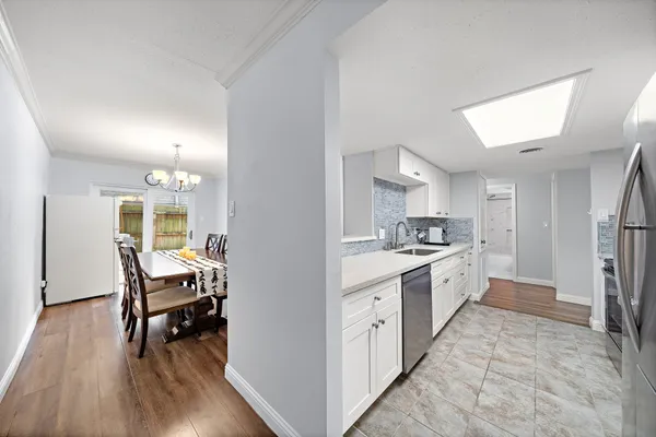 a kitchen with a table and chairs