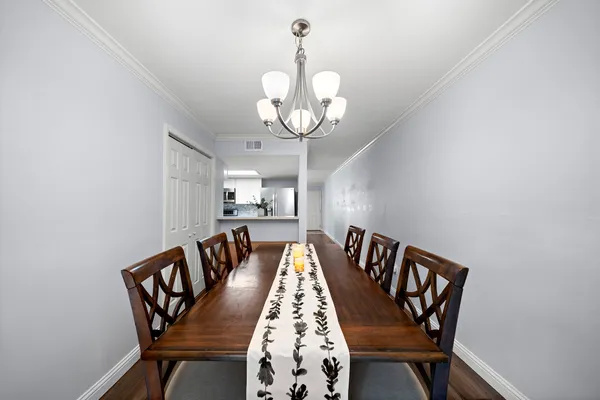 a view of a dining room with furniture and wooden floor