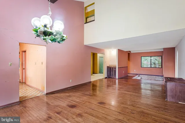 a view of an entryway with wooden floor
