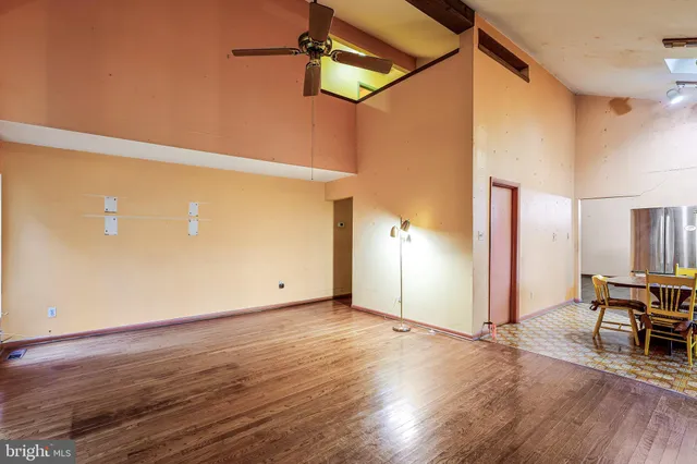 a view of a room with wooden floor