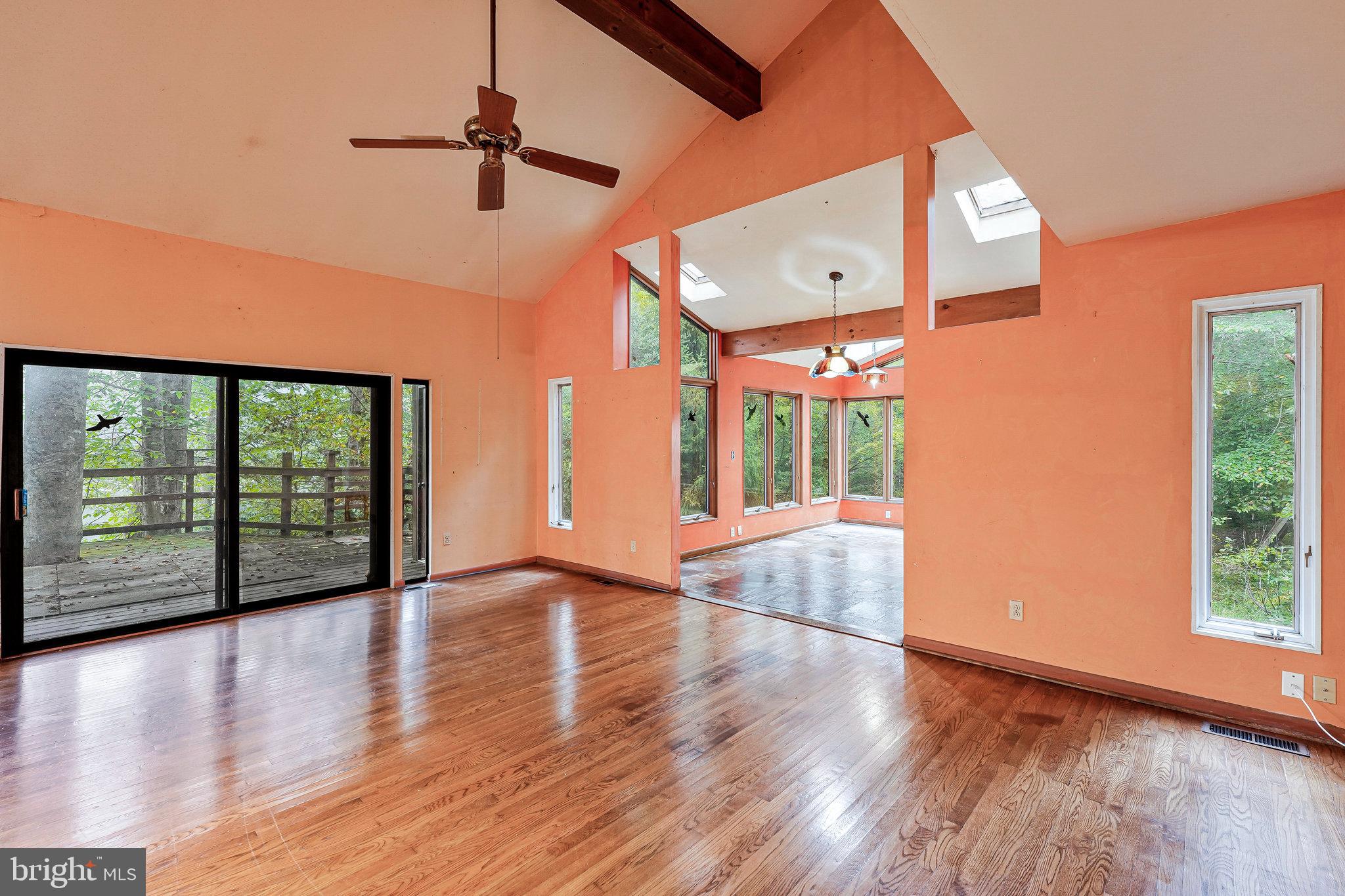 10400 Hampton Road Fairfax Station, VA 22039 - Photo 19 of 53 a view of an entryway with wooden floor staircase and a ceiling fan