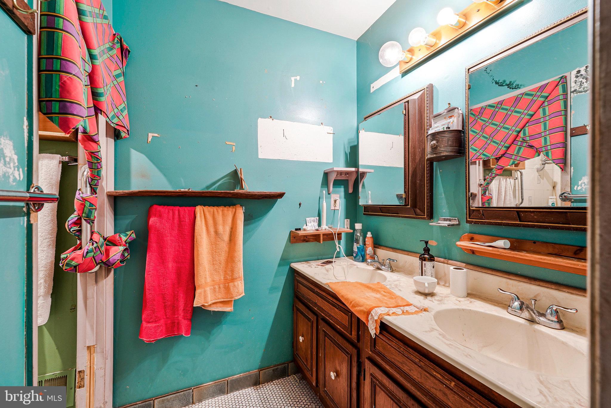 10400 Hampton Road Fairfax Station, VA 22039 - Photo 25 of 53 a bathroom with a sink and a mirror