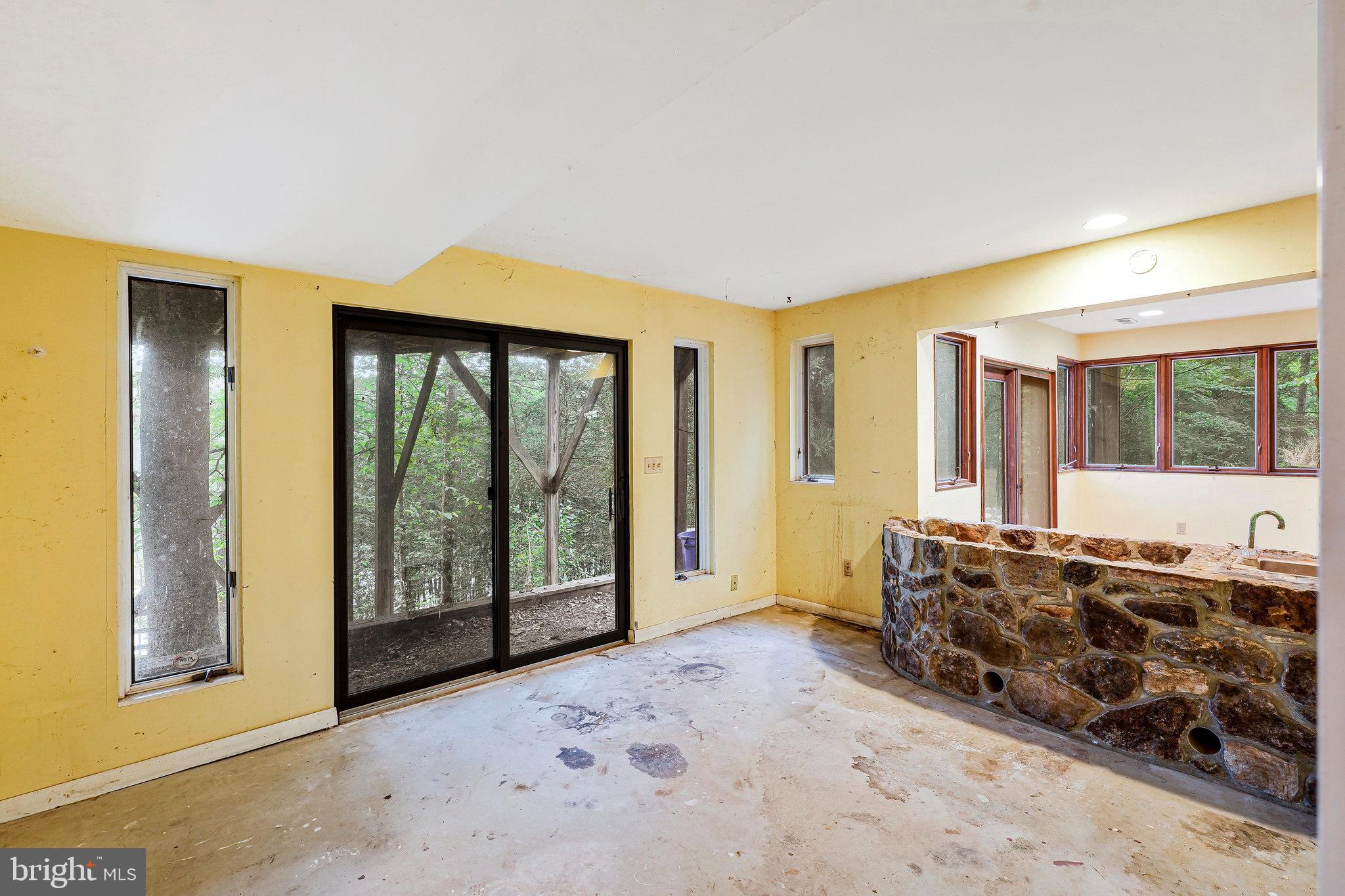 10400 Hampton Road Fairfax Station, VA 22039 - Photo 38 of 53 a living room with furniture and large windows