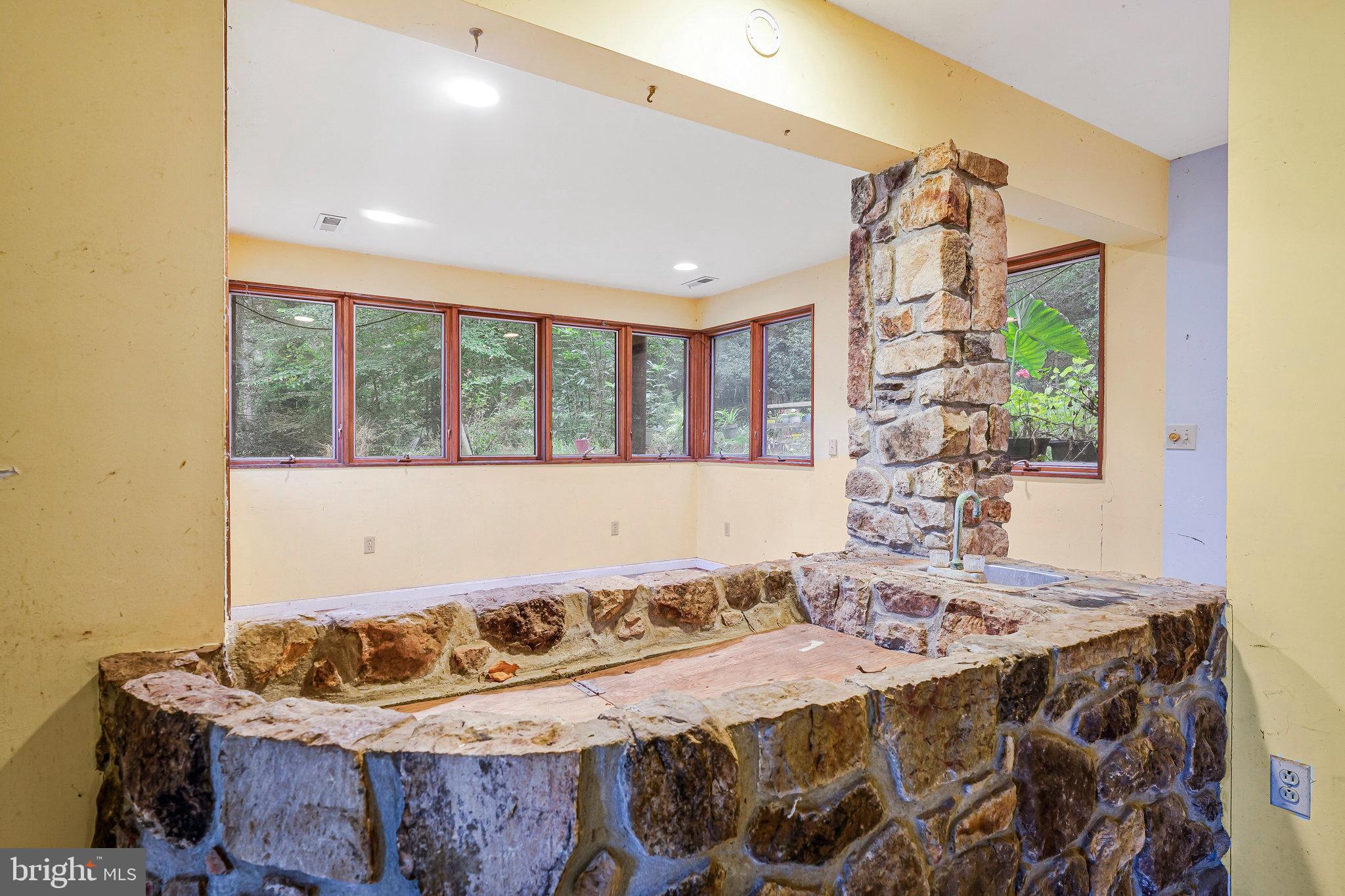 10400 Hampton Road Fairfax Station, VA 22039 - Photo 40 of 53 a bed sitting in a bedroom next to a window
