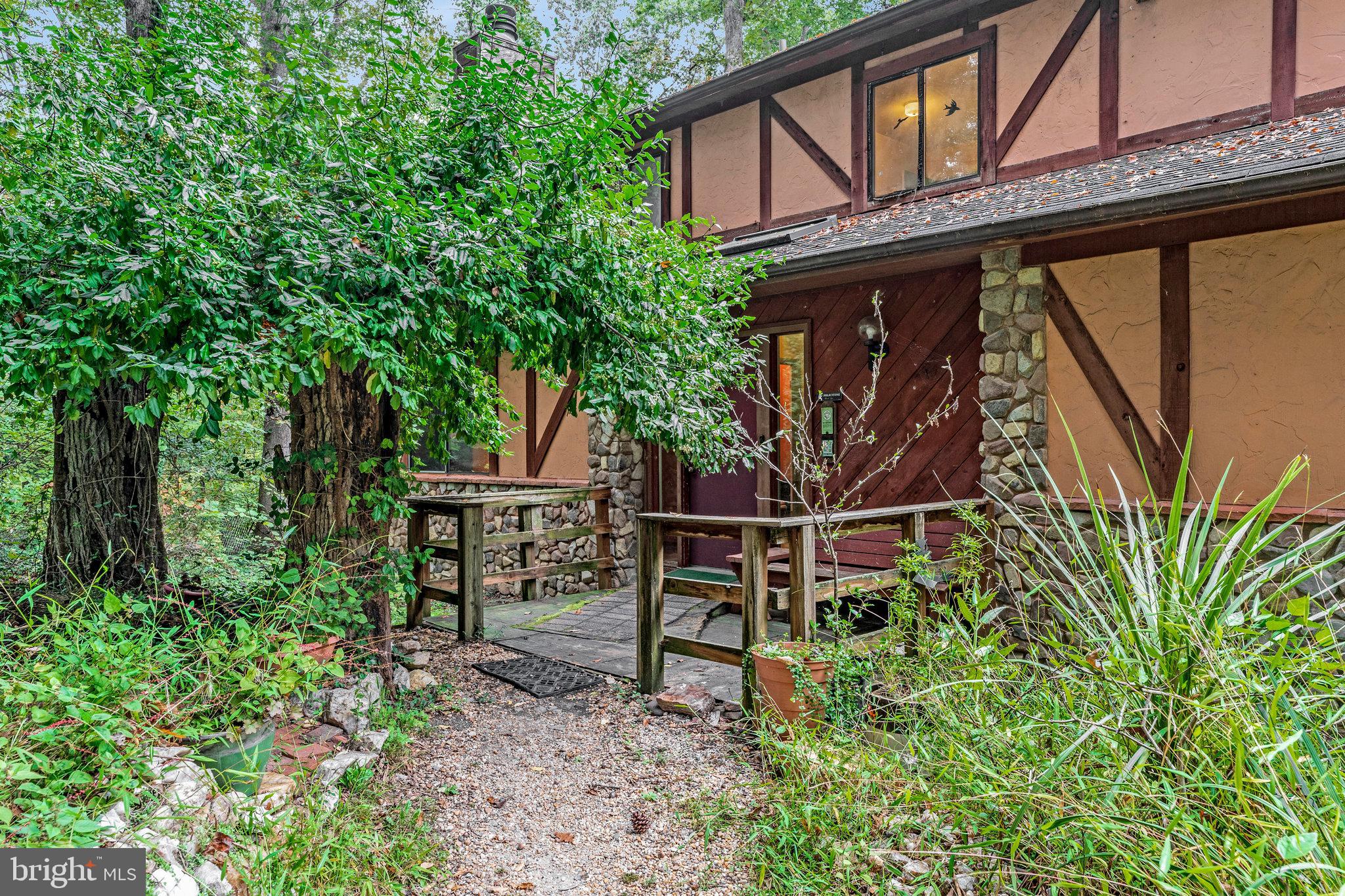 10400 Hampton Road Fairfax Station, VA 22039 - Photo 6 of 53 a backyard of a house with lots of green space and wooden fence