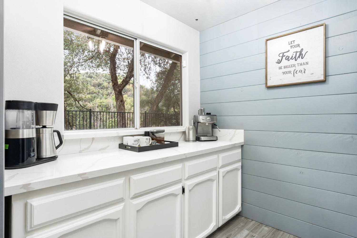 36345 Mudge Ranch Road Coarsegold, CA 93614 - Photo 13 of 51 a kitchen with a sink and a window