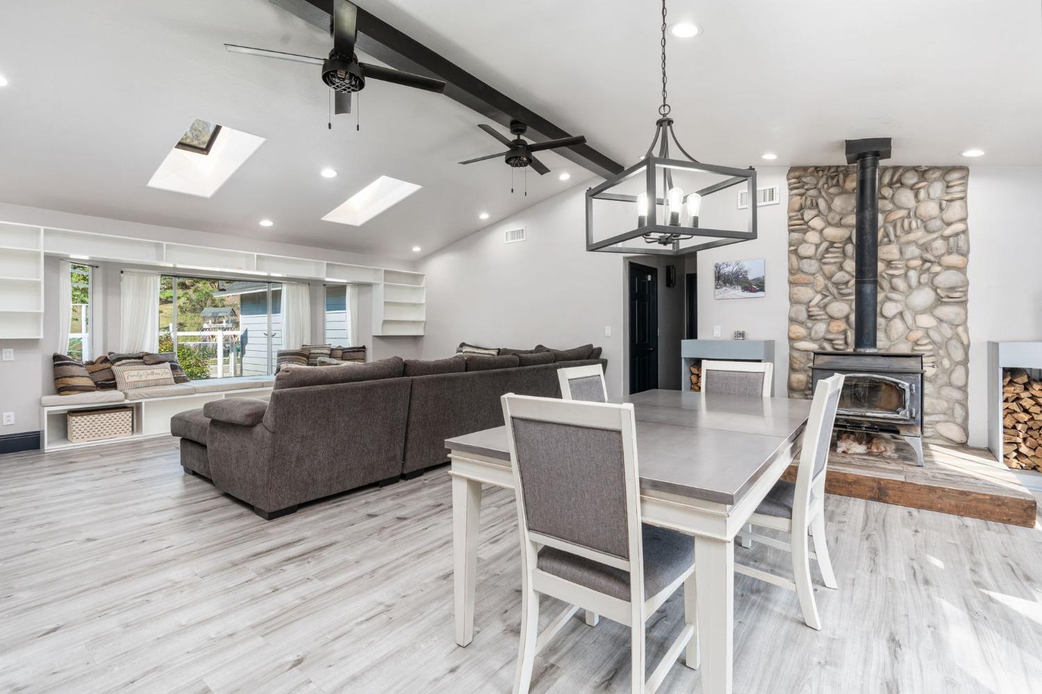 36345 Mudge Ranch Road Coarsegold, CA 93614 - Photo 15 of 51 a view of a dining room with furniture window and wooden floor