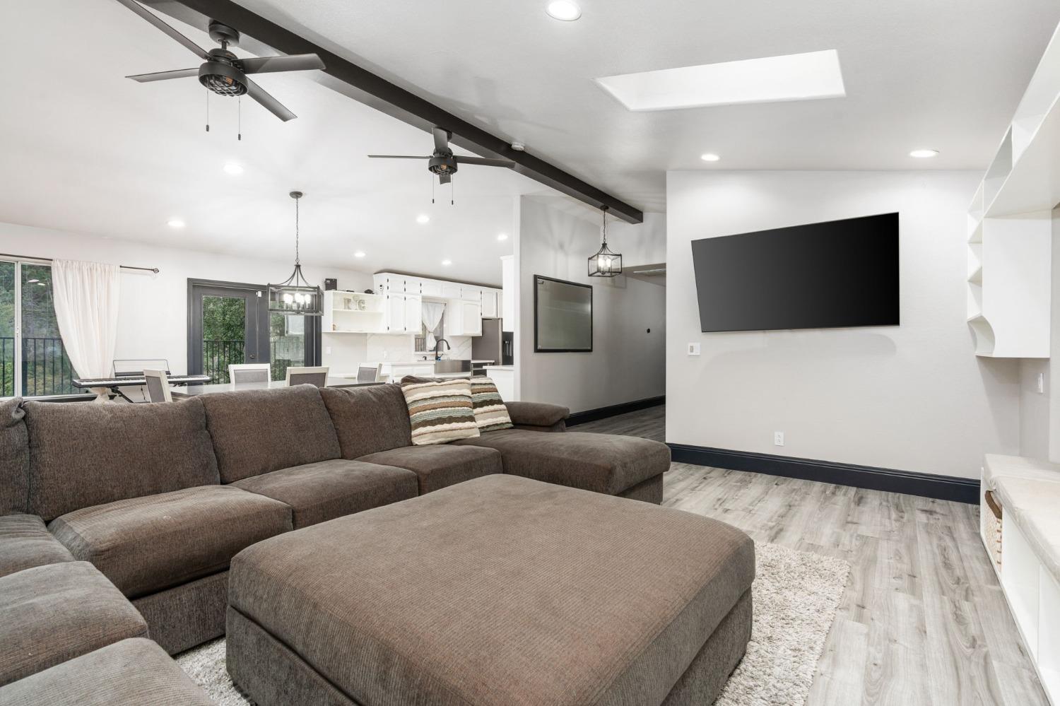 36345 Mudge Ranch Road Coarsegold, CA 93614 - Photo 16 of 51 a living room with furniture and a flat screen tv