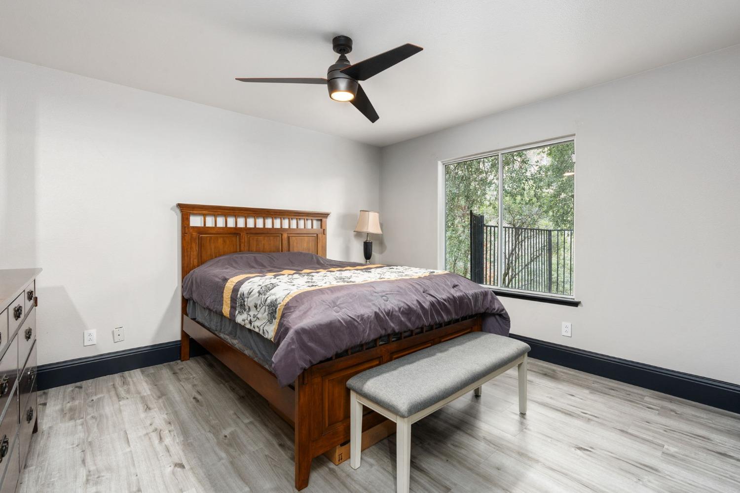 36345 Mudge Ranch Road Coarsegold, CA 93614 - Photo 18 of 51 a bedroom with a bed and a window