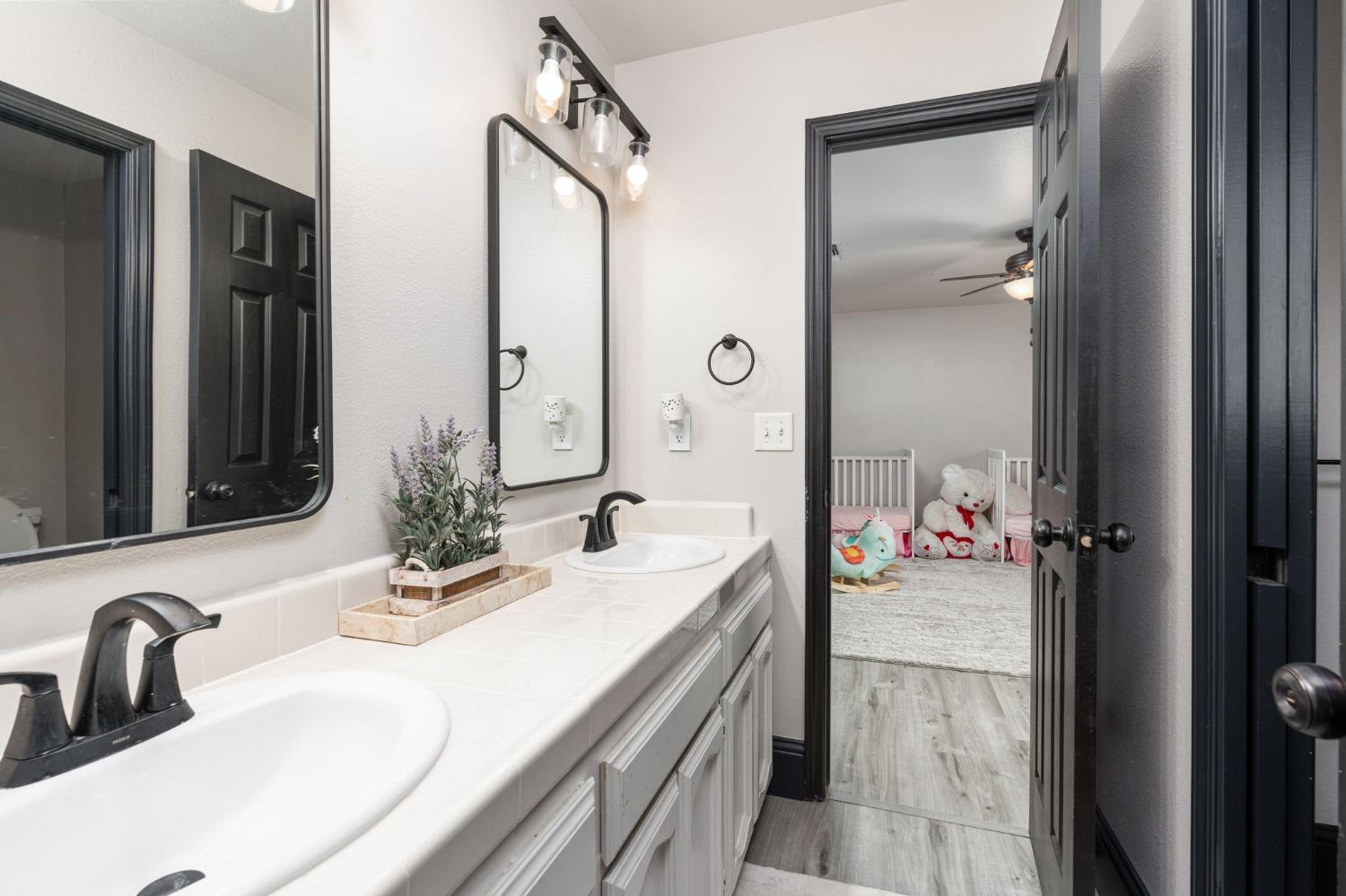 36345 Mudge Ranch Road Coarsegold, CA 93614 - Photo 22 of 51 a bathroom with a sink and a mirror