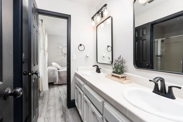 a bathroom with a sink and a mirror
