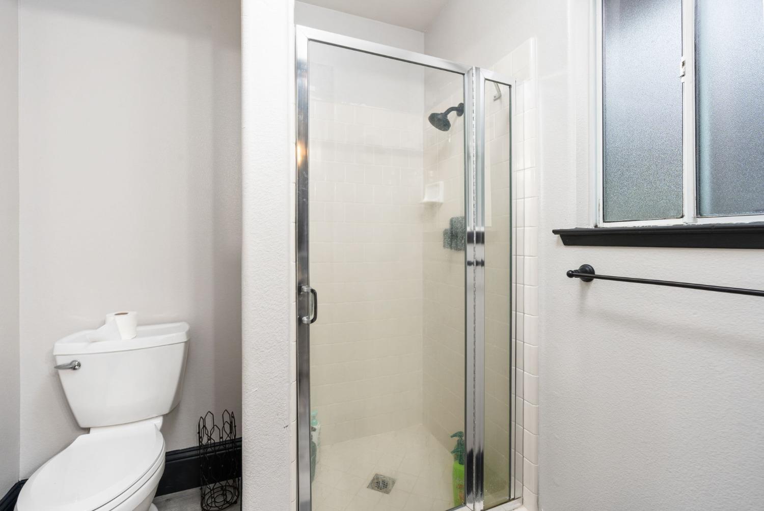 36345 Mudge Ranch Road Coarsegold, CA 93614 - Photo 24 of 51 a bathroom with a toilet and shower