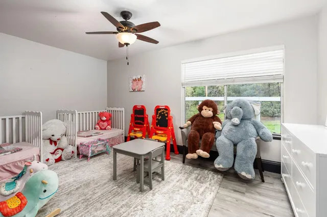 a living room filled with furniture and a window